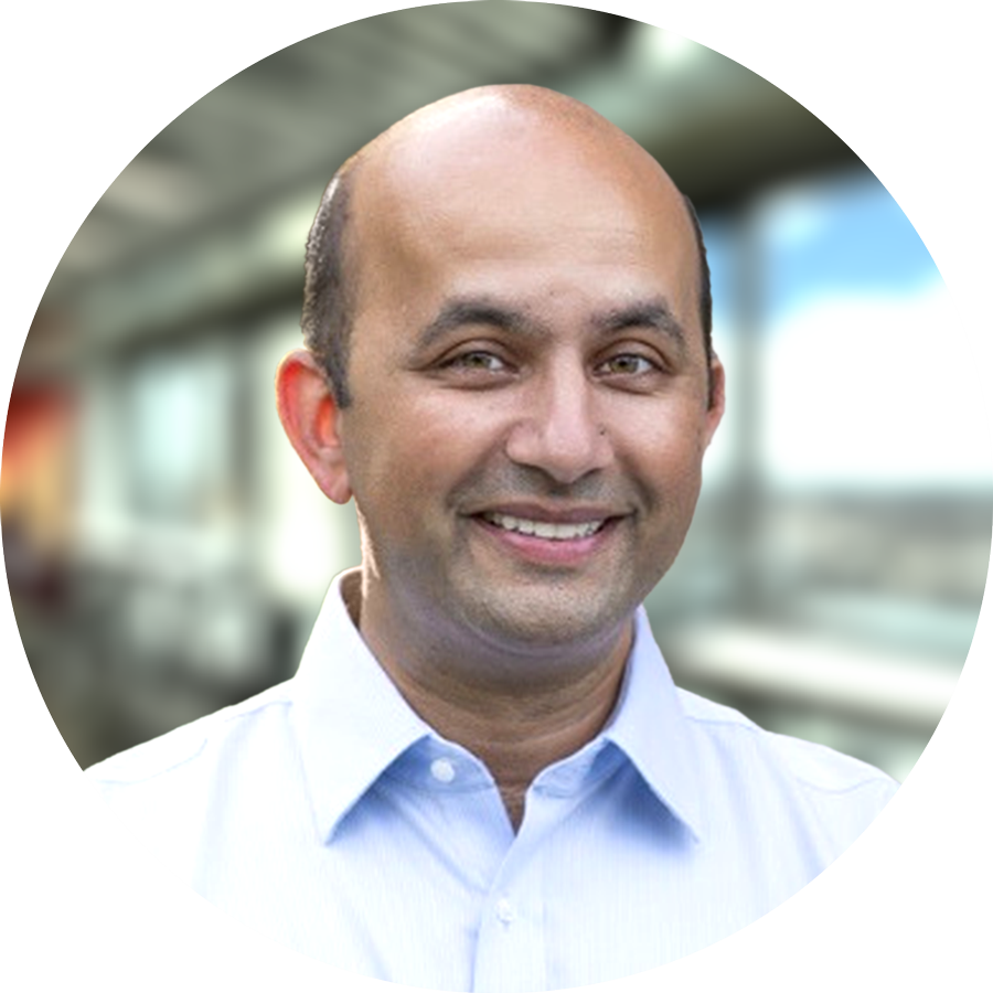 Nirav Vakharia, MD, serves as Chief Health Officer of Marathon Health, seen posing for a photo with a bright smile on his face